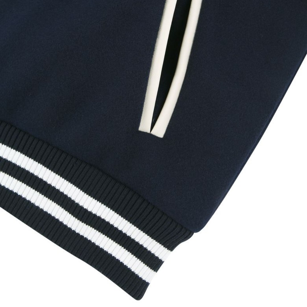 Navy wool varsity jacket with cream leather sleeves by NP Leather